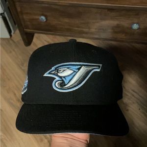 Blue jays black and baby blue side patch. Size 7 3/8.